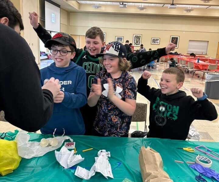 Kids smiling and celebrating success